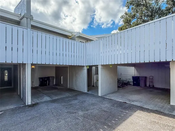 a view of a kitchen with a sink and a fireplace