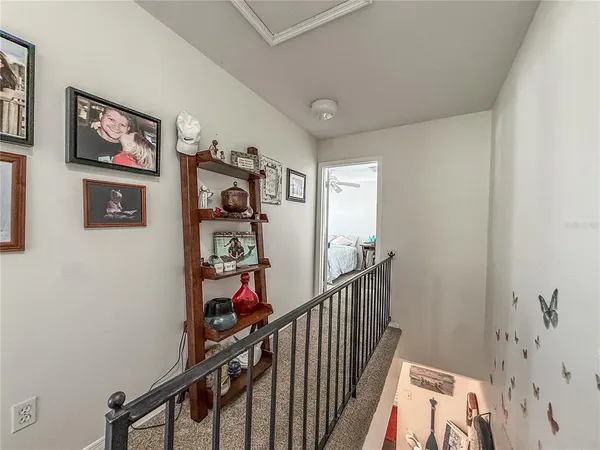 a bedroom with bed and a chandelier
