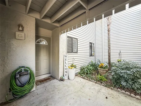 a view of a porch with a sink and a window