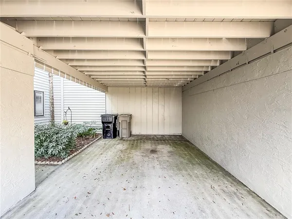 a view of a balcony with furniture
