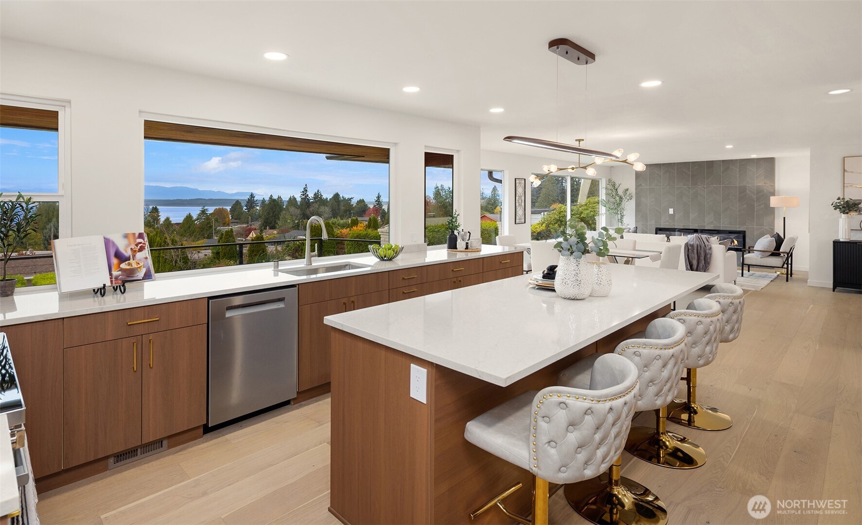 12711 9th Avenue Northwest Seattle, WA 98177 - Photo 15 of 40 a view of a kitchen with kitchen island a sink and a large window
