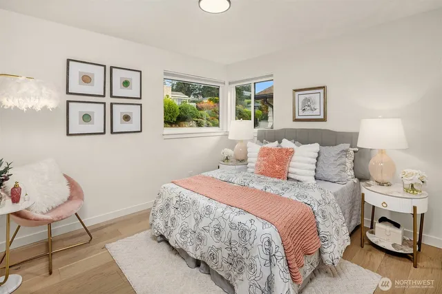 a bedroom with a bed and lamp