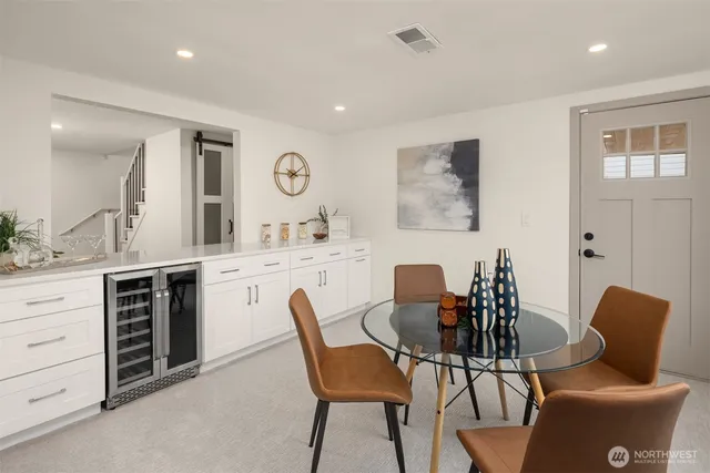 a dining room with furniture and window