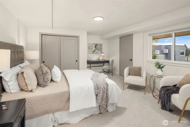 a bedroom with a bed and a couch