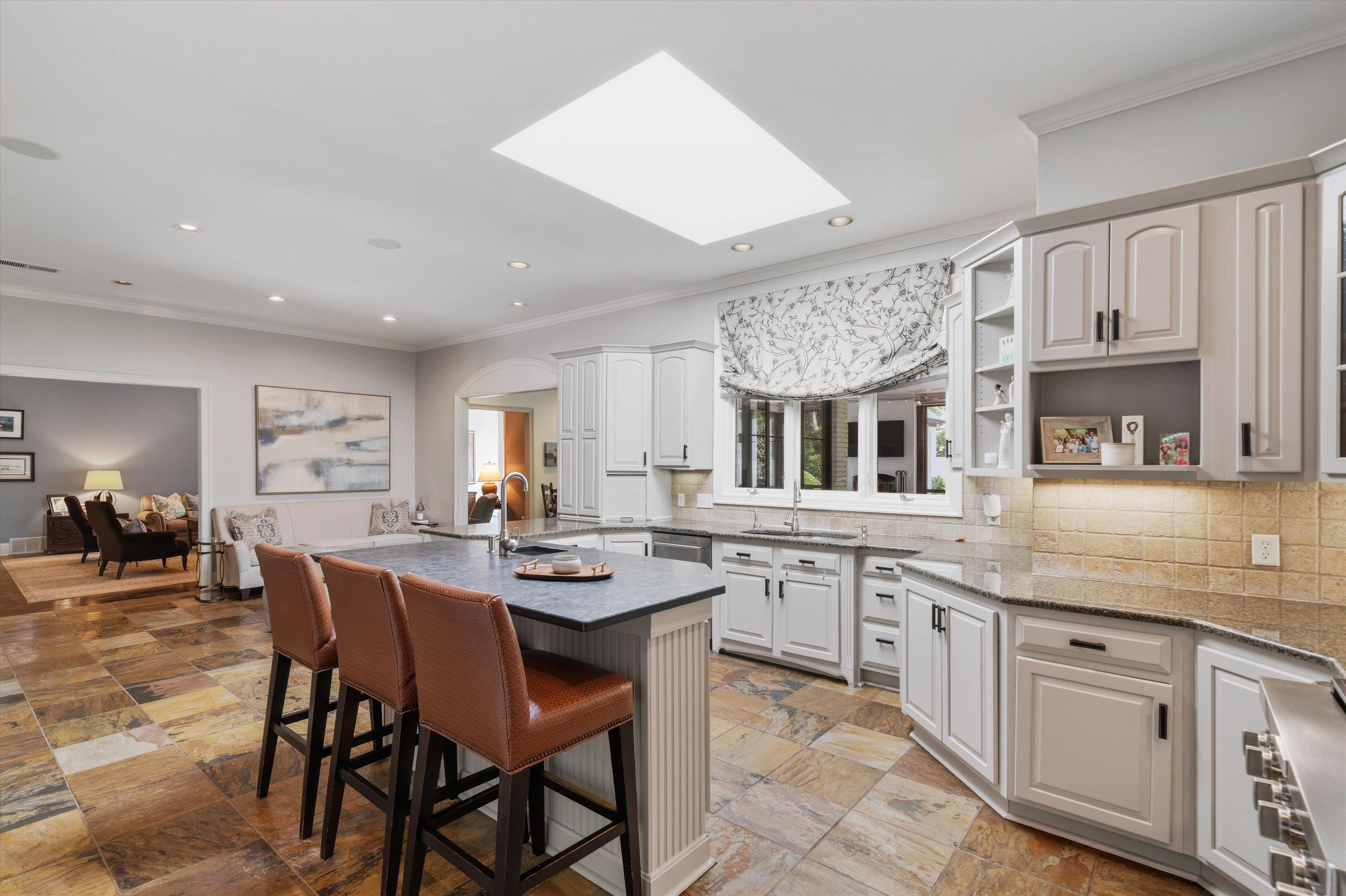 4710 Gwynne Road Memphis, TN 38117 - Photo 14 of 40 a kitchen with lots of counter top space and dining table
