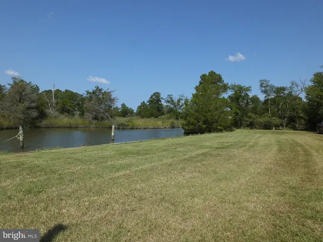 a house view with a sitting space and garden