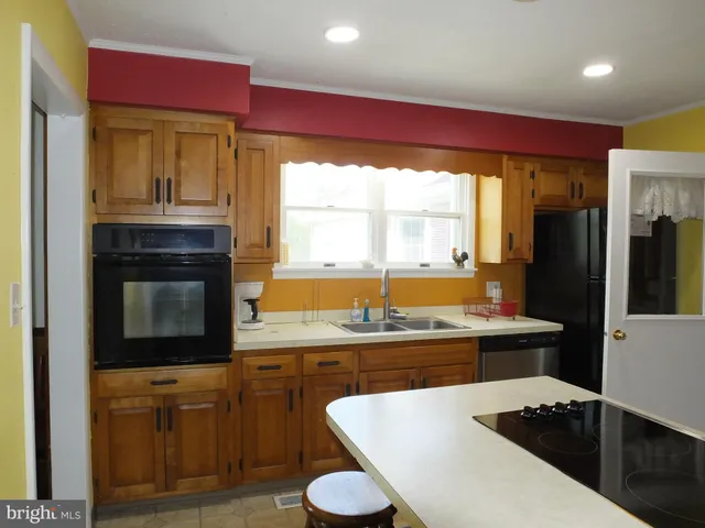 a view of a city from a dining room with large windows and outside view