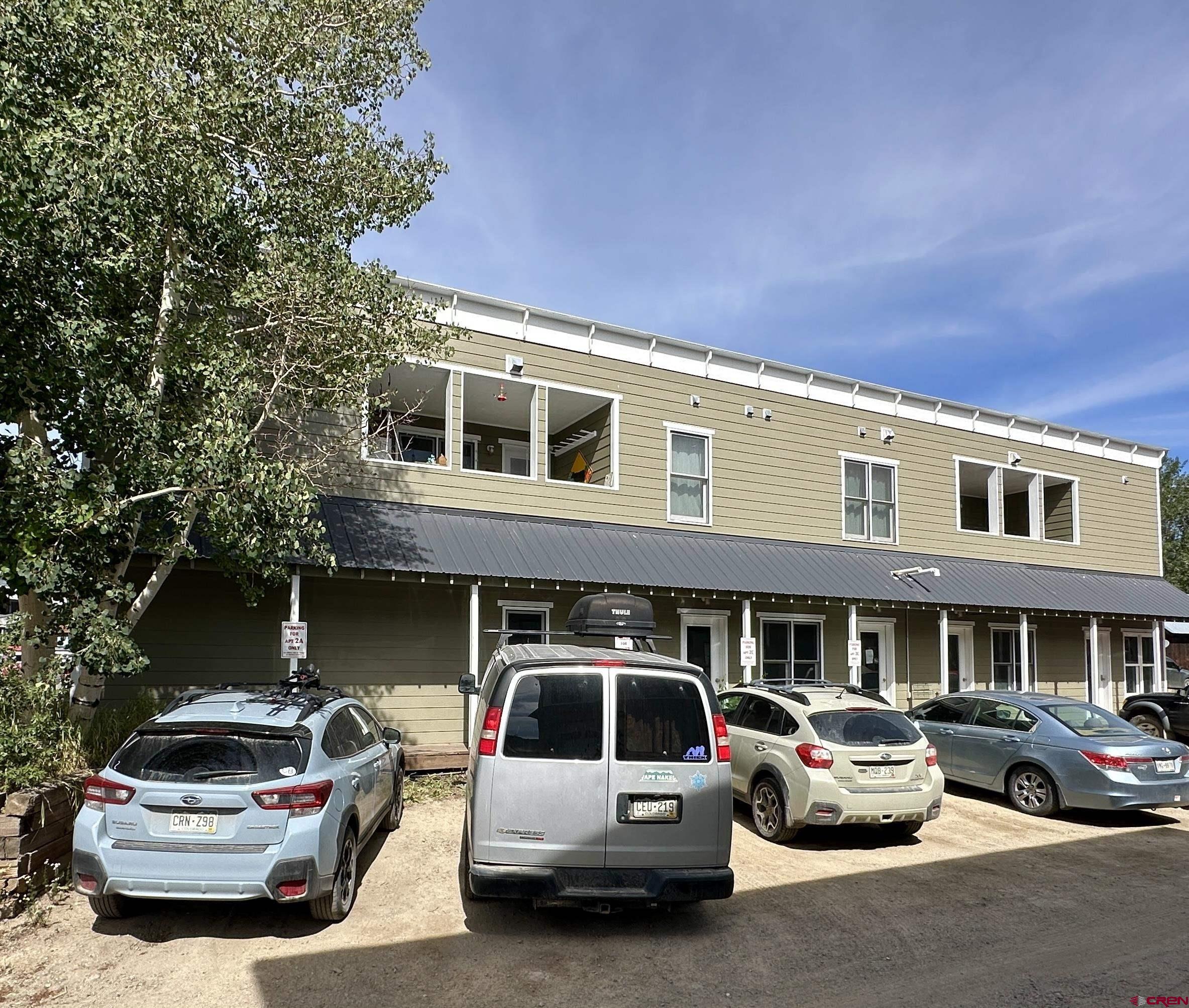 309 Belleview Avenue, Unit 2C Crested Butte, CO 81224 - Photo 1 of 17 a car parked in front of a building