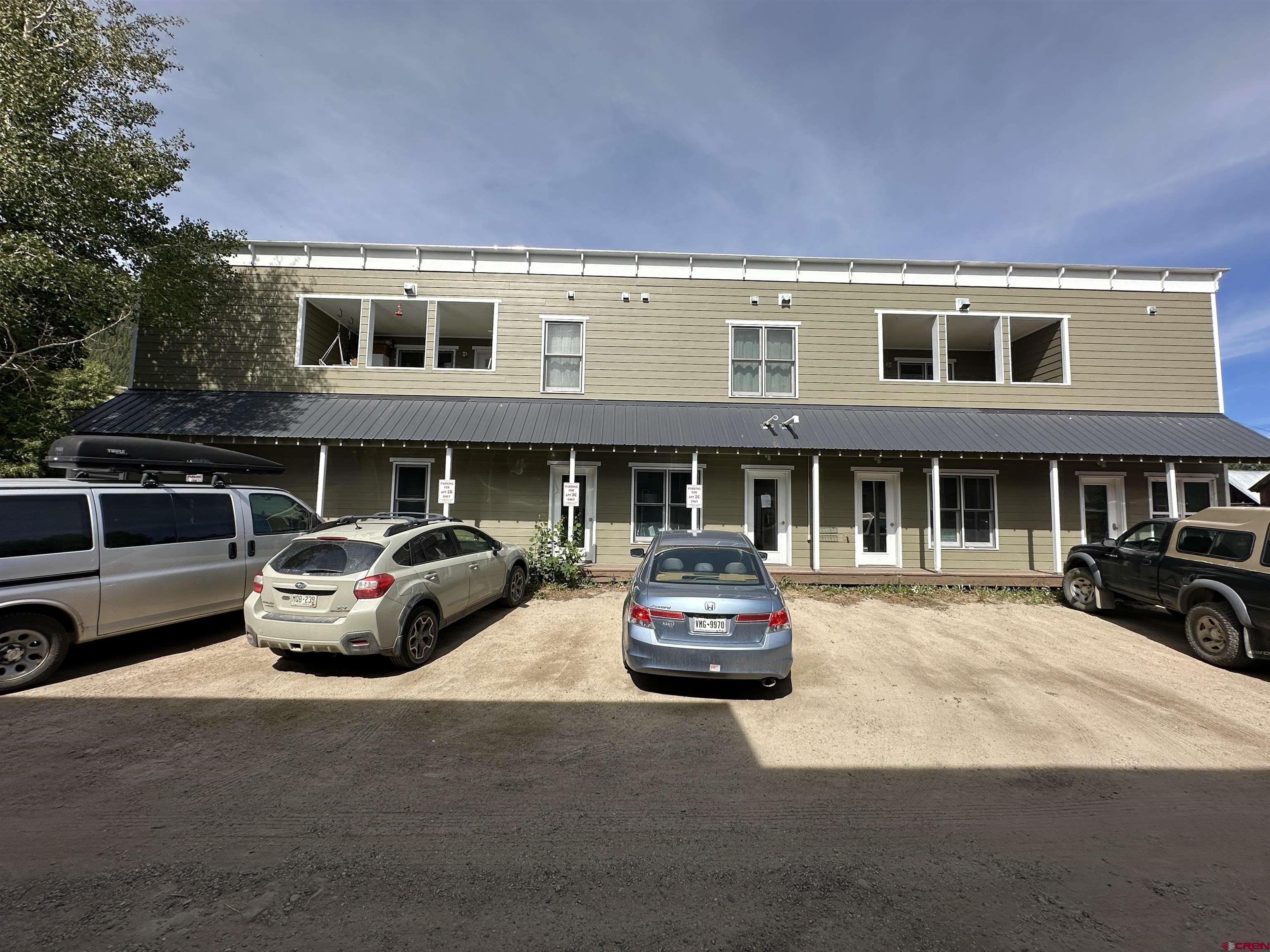 309 Belleview Avenue, Unit 2C Crested Butte, CO 81224 - Photo 2 of 17 a car parked in front of a building