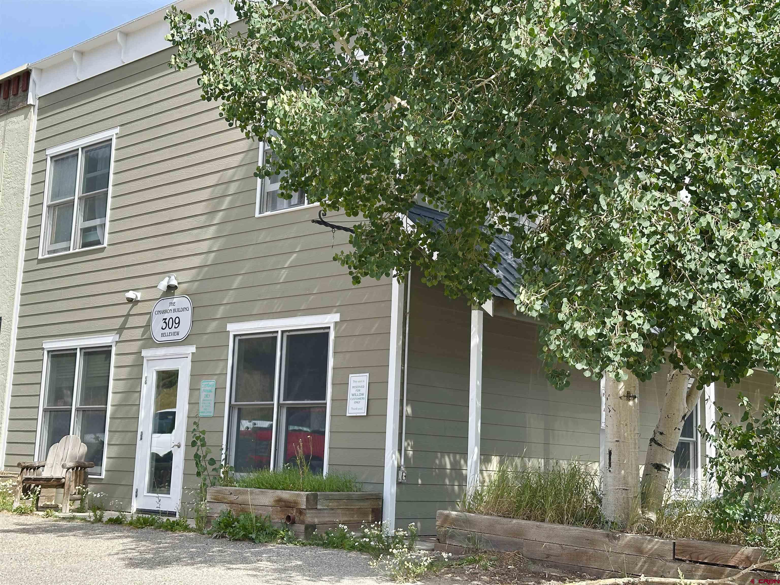 309 Belleview Avenue, Unit 2C Crested Butte, CO 81224 - Photo 3 of 17 a front view of a house with garden