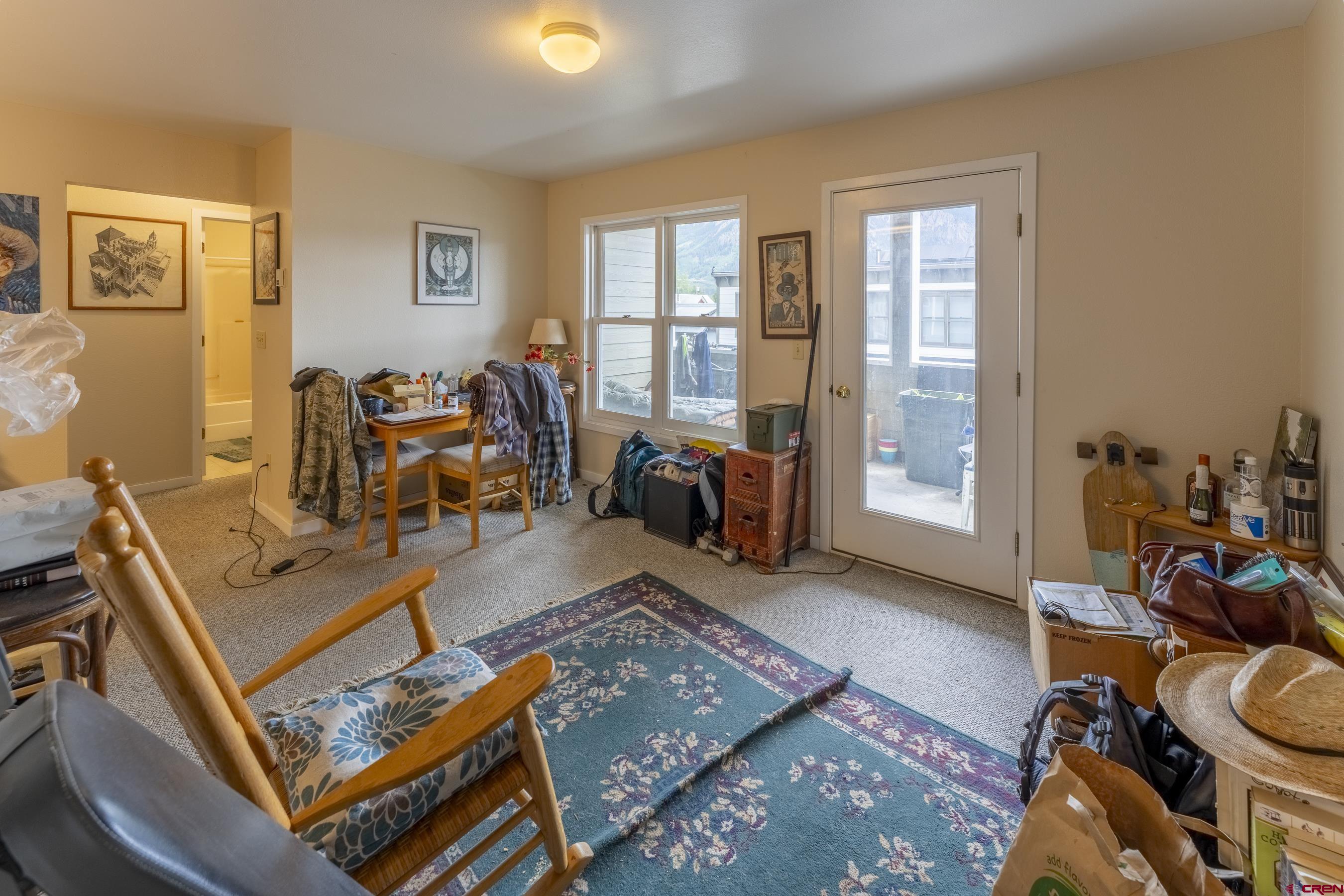 309 Belleview Avenue, Unit 2C Crested Butte, CO 81224 - Photo 8 of 17 a living room with furniture and a window