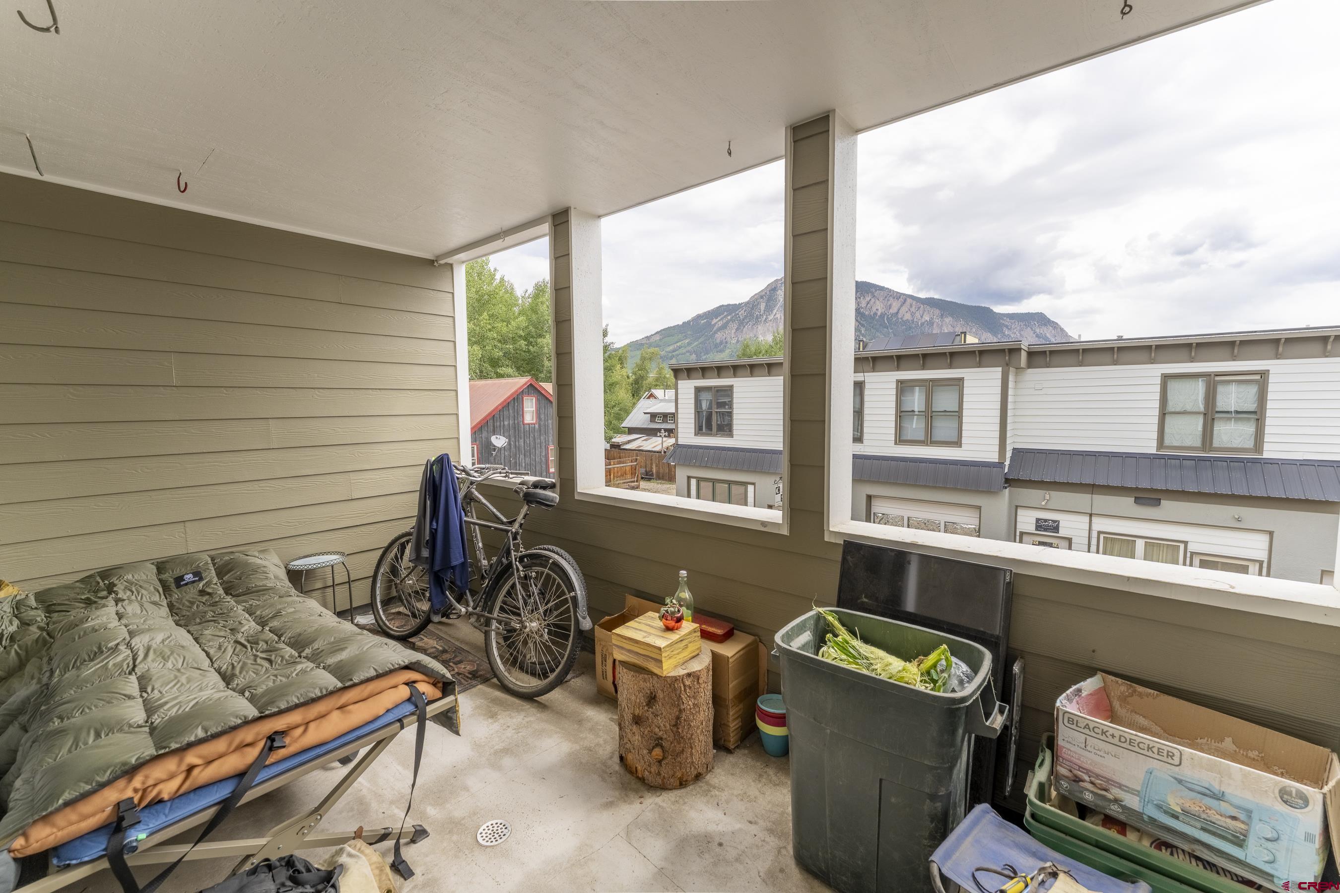 309 Belleview Avenue, Unit 2C Crested Butte, CO 81224 - Photo 9 of 17 a room with furniture and a window