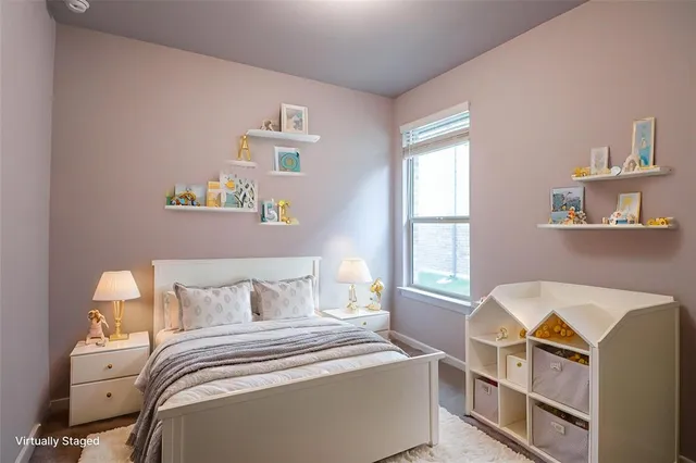 a bedroom with bed and window