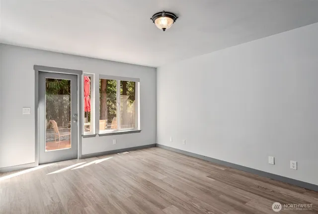 a view of an empty room with a window