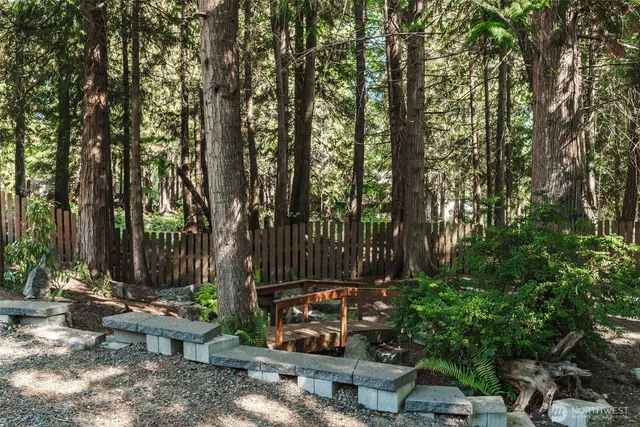 a view of a backyard with sitting area