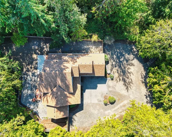 a view of backyard with sitting area