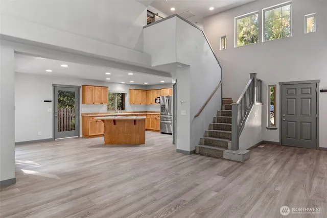 a view of kitchen with furniture and wooden floor