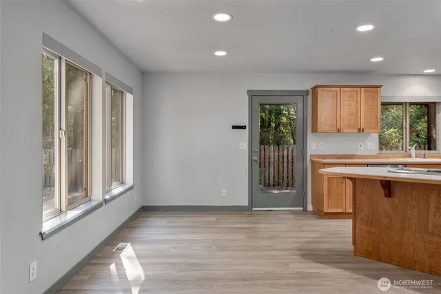 a view of a kitchen with a sink and a window