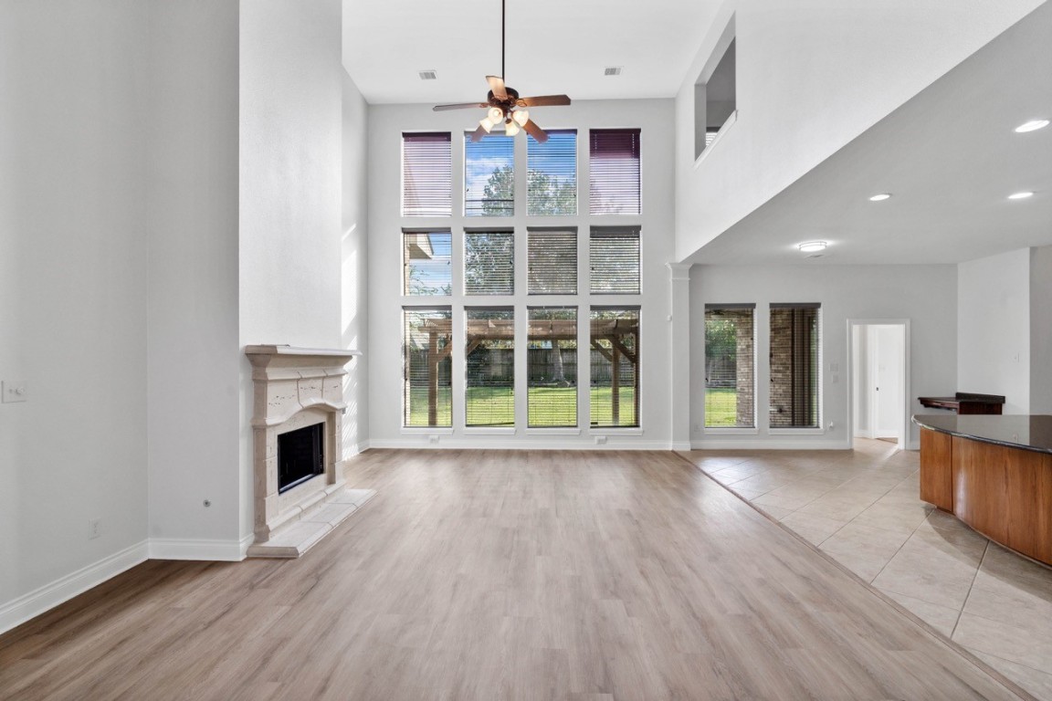 26411 Ridgefield Park Lane Cypress, TX 77433 - Photo 11 of 50 a view of a livingroom with wooden floor and a fireplace