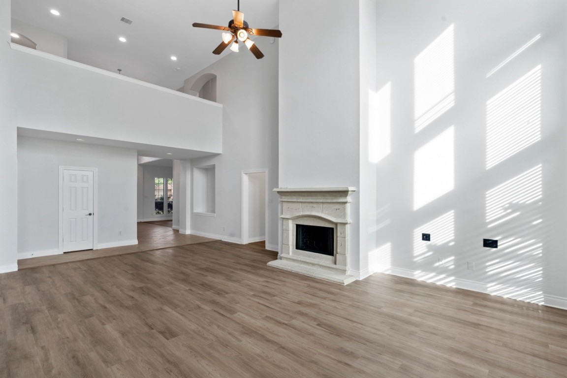 26411 Ridgefield Park Lane Cypress, TX 77433 - Photo 13 of 50 a view of empty room with wooden floor and fan
