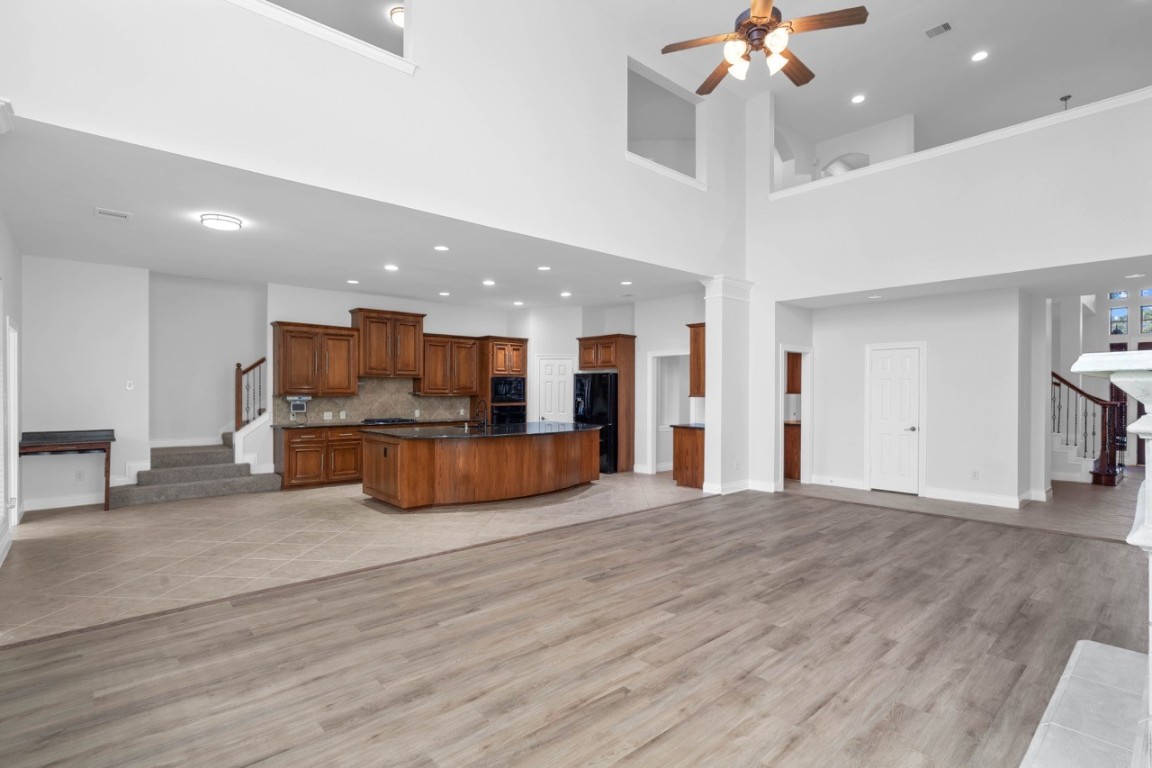 26411 Ridgefield Park Lane Cypress, TX 77433 - Photo 14 of 50 a view of kitchen with kitchen island stainless steel appliances refrigerator oven and stove
