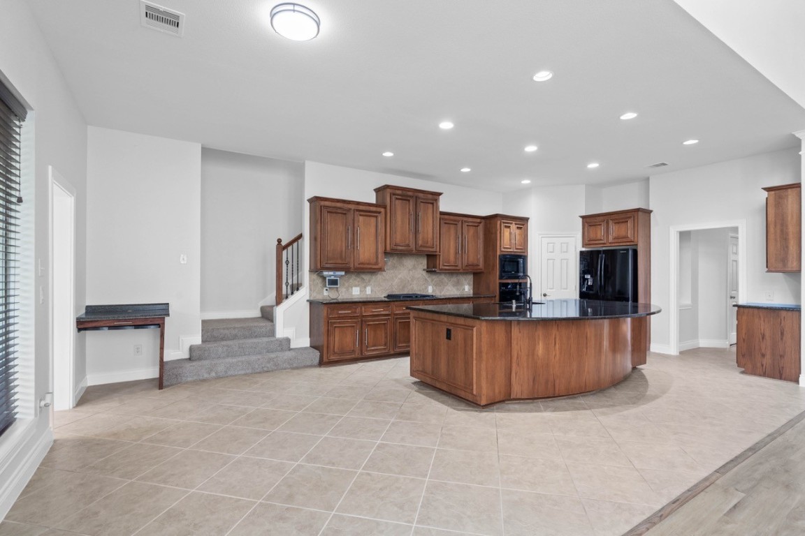 26411 Ridgefield Park Lane Cypress, TX 77433 - Photo 15 of 50 a large kitchen with stainless steel appliances lots of counter top space