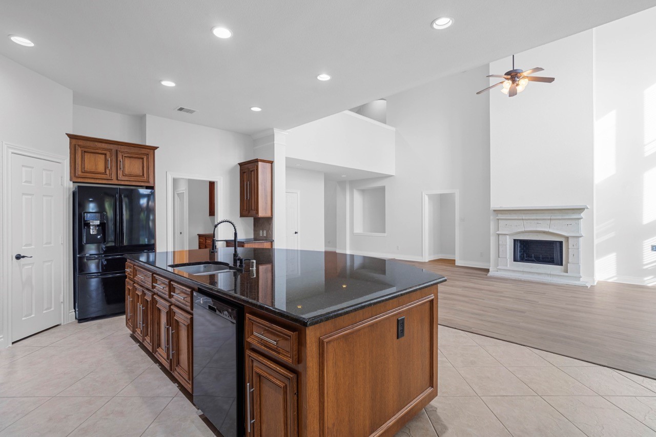 26411 Ridgefield Park Lane Cypress, TX 77433 - Photo 20 of 50 a kitchen that has a sink and a stove in it