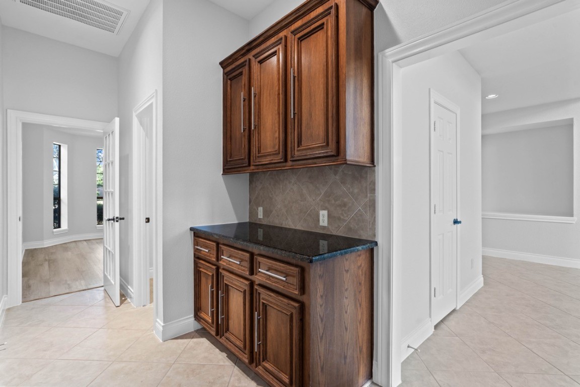 26411 Ridgefield Park Lane Cypress, TX 77433 - Photo 23 of 50 a kitchen with stainless steel appliances granite countertop a refrigerator and a sink