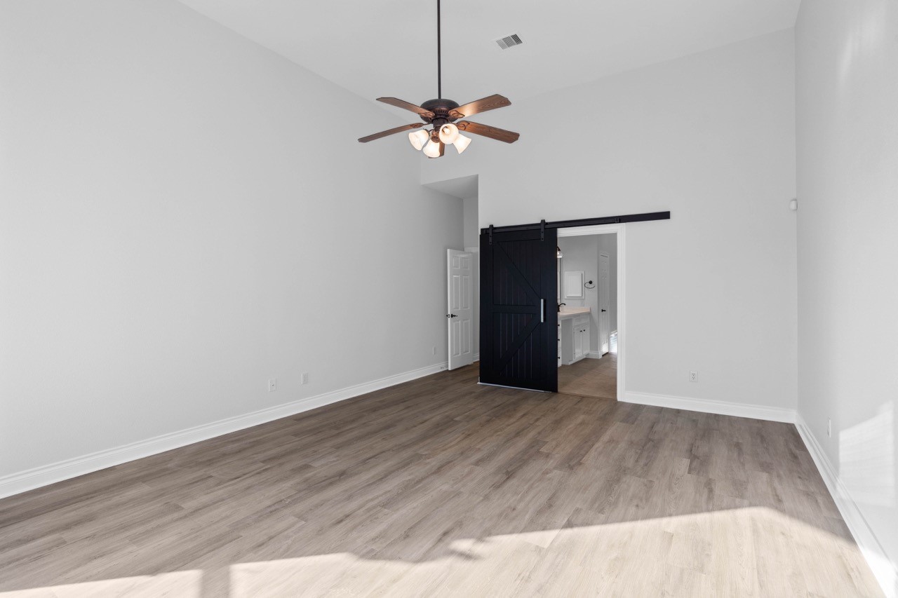 26411 Ridgefield Park Lane Cypress, TX 77433 - Photo 26 of 50 a view of a livingroom with a ceiling fan and a window