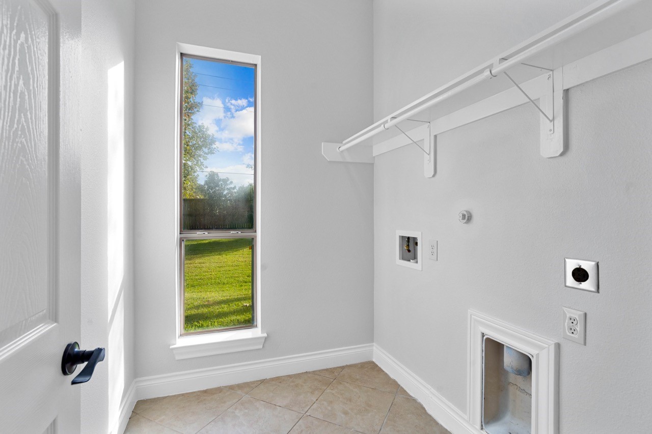 26411 Ridgefield Park Lane Cypress, TX 77433 - Photo 31 of 50 a view of a hallway with a white cabinet and a window