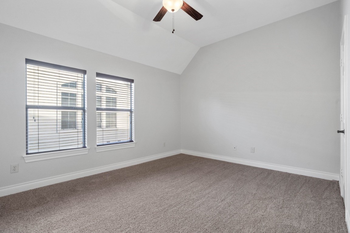 26411 Ridgefield Park Lane Cypress, TX 77433 - Photo 34 of 50 an empty room with chandelier fan