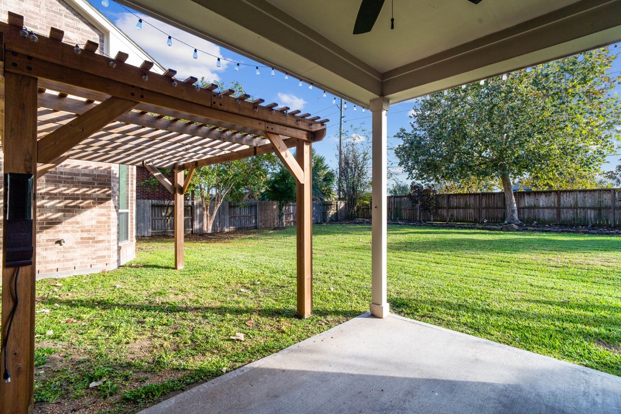 26411 Ridgefield Park Lane Cypress, TX 77433 - Photo 43 of 50 a view of a backyard with garden