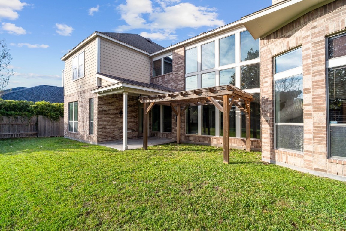 26411 Ridgefield Park Lane Cypress, TX 77433 - Photo 45 of 50 a view of a house with yard and porch