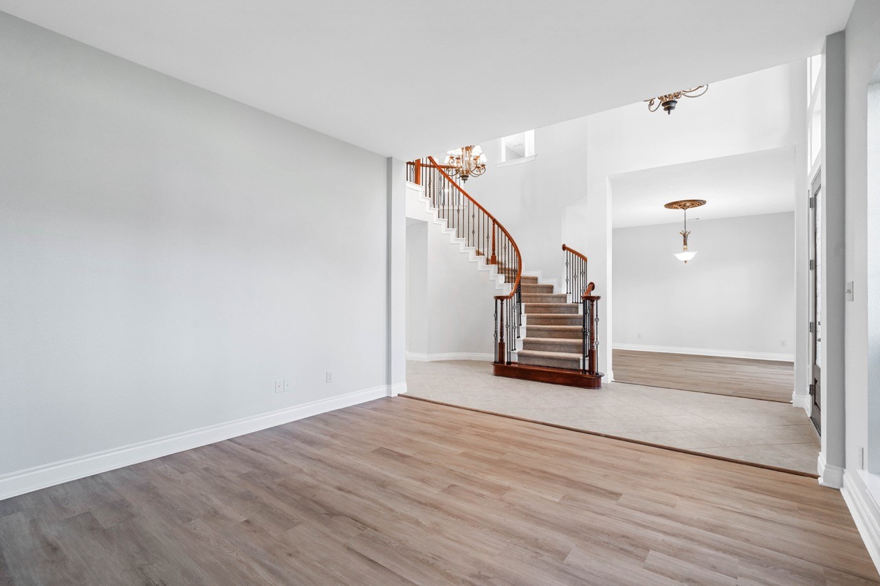 26411 Ridgefield Park Lane Cypress, TX 77433 - Photo 5 of 50 a view of a hallway with wooden floor and staircase