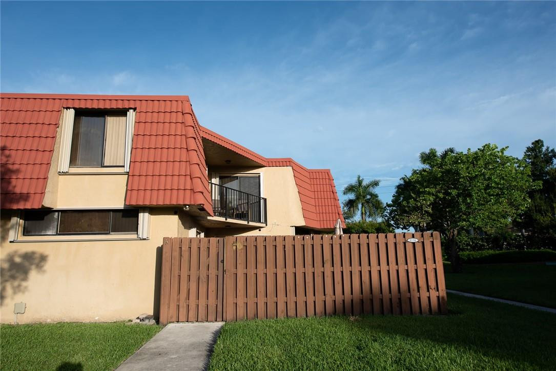 8116 Thames Boulevard, Unit A Boca Raton, FL 33433 - Photo 17 of 27 a front view of a house with garden
