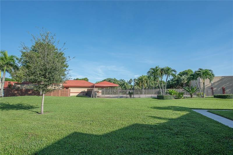 8116 Thames Boulevard, Unit A Boca Raton, FL 33433 - Photo 21 of 27 a view of a park with large trees
