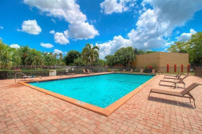 8116 Thames Boulevard, Unit A Boca Raton, FL 33433 - Photo 23 of 27 a view of a backyard with swimming pool