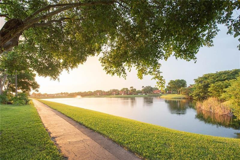 8116 Thames Boulevard, Unit A Boca Raton, FL 33433 - Photo 25 of 27 a view of a lake with outdoor space