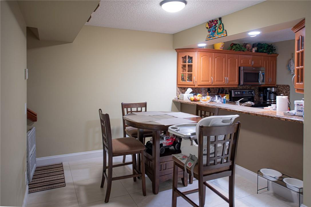 8116 Thames Boulevard, Unit A Boca Raton, FL 33433 - Photo 4 of 27 a view of a dining room with furniture