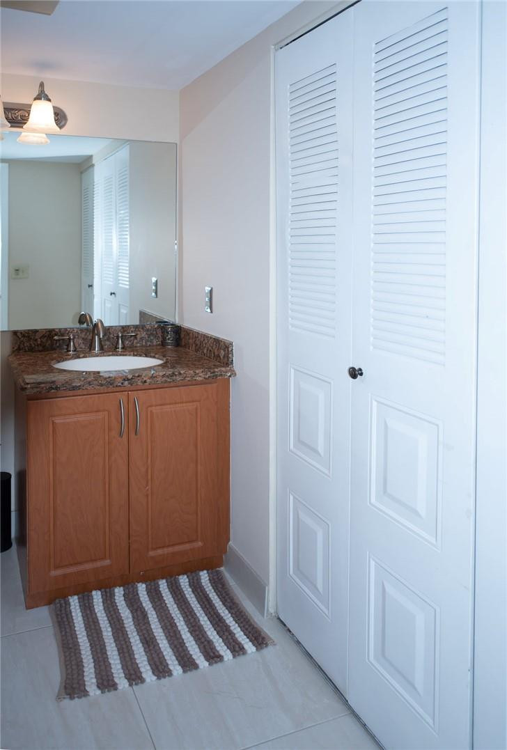8116 Thames Boulevard, Unit A Boca Raton, FL 33433 - Photo 7 of 27 a utility room with cabinets