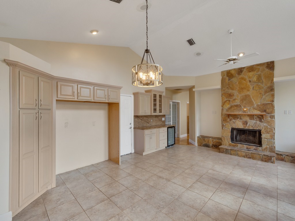 167 Deer Run Road Palm Bay, FL 32909 - Photo 15 of 35 a view of a kitchen with a sink and a fireplace