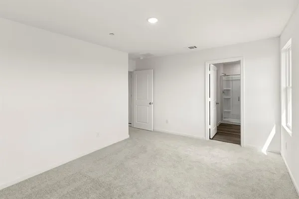 a bathroom with a glass shower door