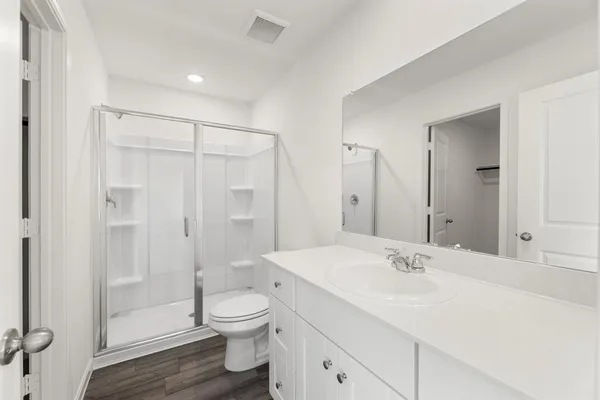 a bathroom with a sink toilet and mirror