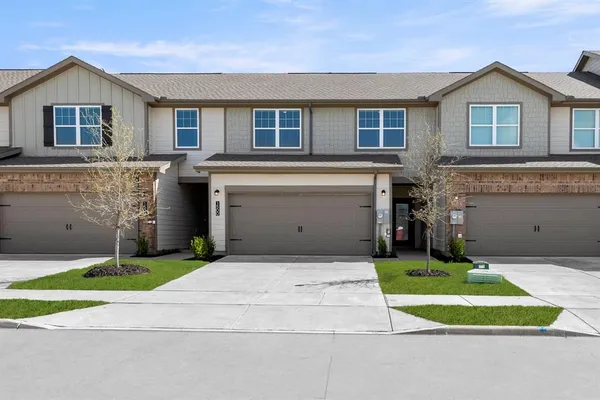 a view of a room with wooden floor and a window