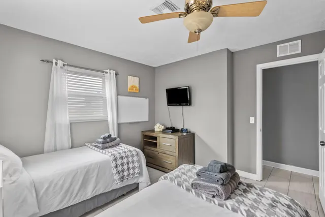 a bedroom with bed and window