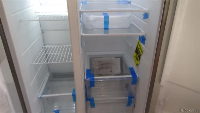 a stove top oven sitting inside of a kitchen