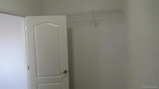 a view of an empty room with windows