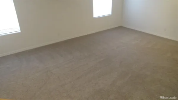 a view of an empty room with stairs