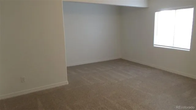 a bathroom with a toilet and a bathtub