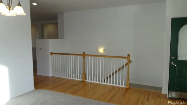 a kitchen with a sink a counter top space and cabinets